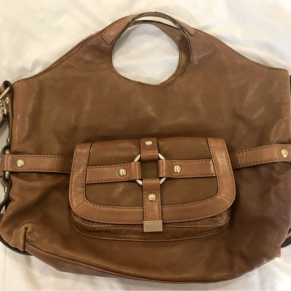 Mk crossbody bag ,Cognac leatherNew bag, used once. Complete with storage bag.